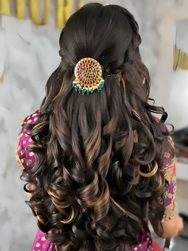 Pinned back curls jewellery attached open hair with saree for wedding