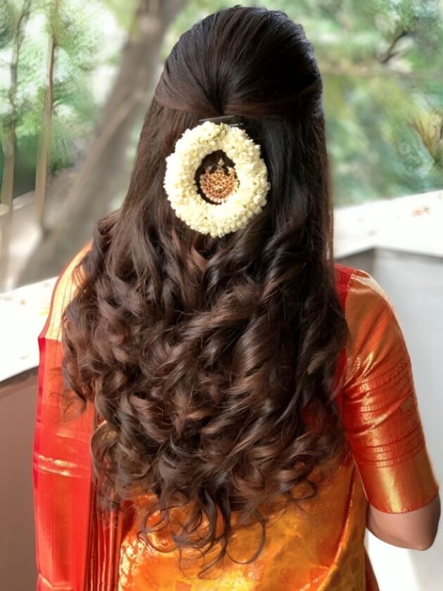 Pinned back curls with gajra for wedding