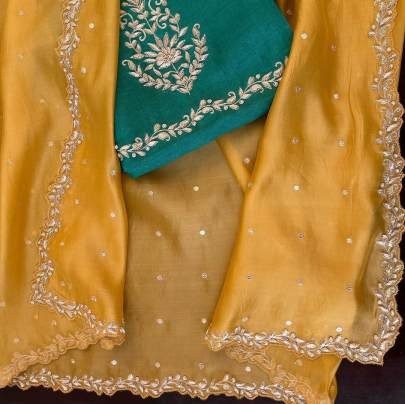 haldi special mustard yellow tebby silk saree with tread and moti work