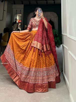 Orange Dola Silk Bandhani And Ajrakh Print With Foil Work Lehenga