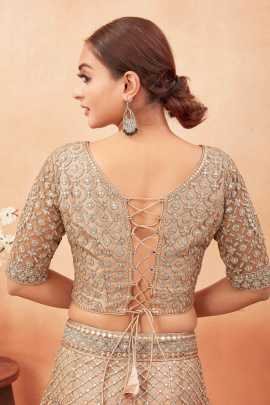 Wedding Wear Cream Color Stone and Embroidered Work Net Lehenga choli